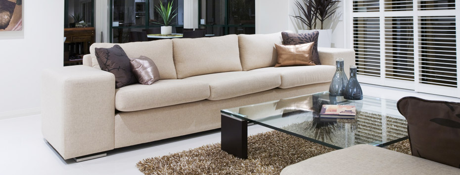 Luxurious living room with dining table in the background